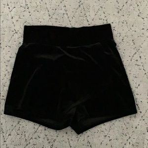 A black skort (skirt/ shorts)